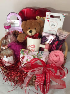 Nothing says be my Valentine like this gift of "A Thousand Kisses with All My Love". This custom-made basket is filled with lots and lots of treats. This gift is perfect for that special someone you want to be spoiled all year long! It's filled with treats for a continuous gift that keeps on giving! Let us customize your Valentine's Day Gift for someone special! Your recipient will be beyond pleased to receive these hand-selected gift items.
