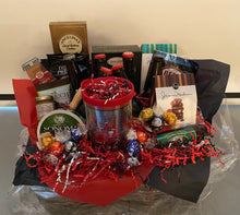 Load image into Gallery viewer, Our Tampa Bay Gift Basket was a custom-made gift basket for a true fan! Preparing for a game and having a gift basket like this will make any tailgater feel over the top! We have added sweet and savory treats along with a special selection of memorabilia for this fan! Included reusable basket, Tampa Bay reusable cup, crisps, peanuts, cheese straws, cheese, beer, (we cannot ship adult beverages but will substitute for extra snacks) 