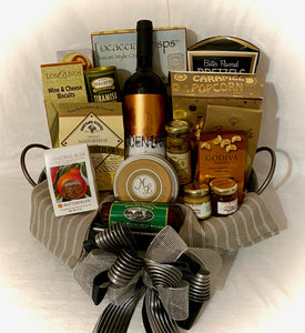 We have included Focaccia Crisps, Caramel Popcorn, Water crackers, Salami sticks, Wine & Cheese Biscuits, Chocolate Covered Almonds, Cookies, Mustard & Jam, Butter Pretzels, Caramels, and so much more! Your gift will be wrapped beautifully in a cello and comes with a notecard and a beautiful handmade bow!   We can customize this gift by wine preference, and bow color. We cannot ship wine but we can substitute wine for extra treats or non-alcoholic adult drinks.