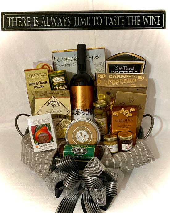 There is Always Time to Taste the Wine ... what a perfect gift for your wine enthusiast. This gift has a variety of treats for all. The kind of gift you can share or simply enjoy alone. Great for Mother's Day, Father's Day, Grandparents Day, New Home, Engagement, Wedding Day, Realtor gifts, Retirement, and so much more! They will love and enjoy a bottle of wine delivered in a beautiful basket tray great for serving it on. We have lined the basket with two kitchen towels, and filled it with delicious treats.