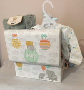 This gift will be in a cute canvas storage tote, flip-top box, diaper bag, backpack, or matching color container. Our neutral color will be a mix as shown in the photo. We will shrink-wrap your gift, and add a personalized notecard and a beautiful handmade bow.