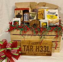 Load image into Gallery viewer, Customized Christmas Crate is the absolute overfilled and stuffed-to-the-top gift. We have hand-selected products from local artisans made in the Carolinas. This variety of delicious treats is a perfect combination of good southern love! Our crates come filled with a selection of popcorn, pretzels, soups, grits, honey, couch mix, dips, toffee, chocolate and so much more.