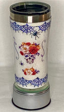 Load image into Gallery viewer, Skeleton Chic is a handmade 20-ounce tumbler that is hand-painted with glitter, waterslide, and epoxy. It&#39;s perfect for those who love creepy, crawlers skeleton heads and Halloween! It comes with a lid. We can personalize and design these tumblers any way you like. We can add monograms, names, sayings, etc. We can design by color, size, and your preference of personalization.