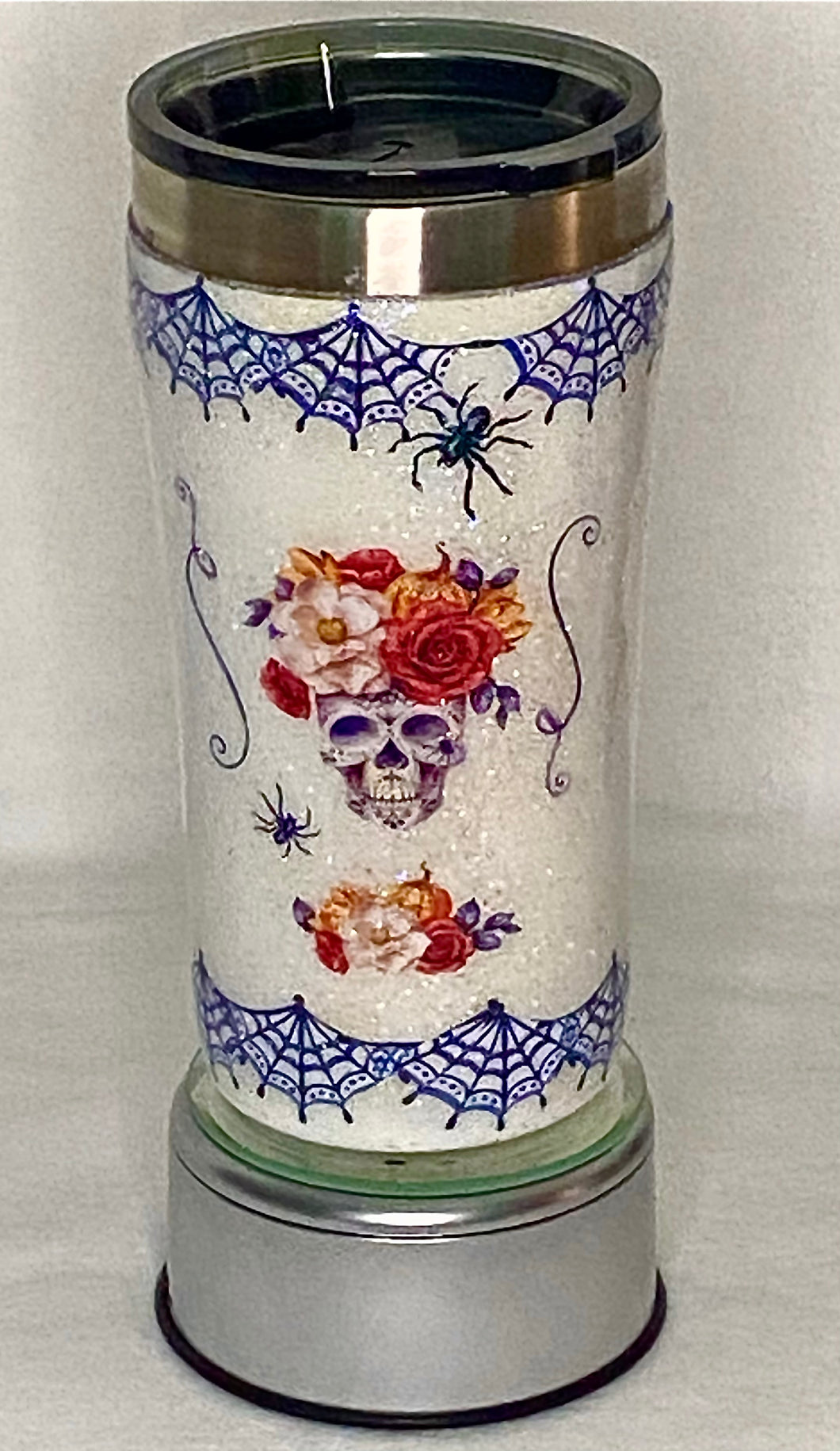 Skeleton Chic is a handmade 20-ounce tumbler that is hand-painted with glitter, waterslide, and epoxy. It's perfect for those who love creepy, crawlers skeleton heads and Halloween! It comes with a lid. We can personalize and design these tumblers any way you like. We can add monograms, names, sayings, etc. We can design by color, size, and your preference of personalization.
