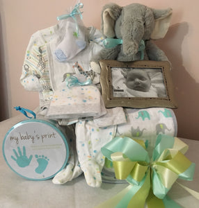A New Baby in Town....is one of our "Best Sellers!" Our neutral color baby gift allows parents to create memorable keepsakes and have necessities for their new baby. Nothing says welcome baby like these beautifully hand-selected neutral color gifts appropriate for either gender. This gift will come with a mixture of a neutral color comfy outfit, socks, bibs, toy, picture frame, baby keepsake and so much more for any new parent to pamper their new baby with. Colors may vary.