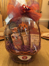 Load image into Gallery viewer, Trick or Treat Me...is the perfect gift of the season to prepare them for Halloween and fall! This reusable gift basket or container is filled with treats for him or her. We have hand-selected delicious treats and bath and body products for that special someone to share or enjoy. We can make this basket with women&#39;s or men&#39;s products. We have included in this gift Hot Cocoa, Snacks, Chocolate Covered Almonds, Bath &amp; Body Works Hand Cream, 