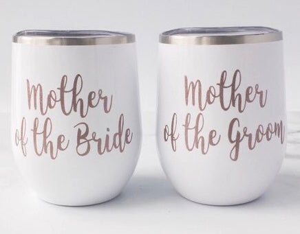Mother of the Bride and Mother of the Groom was specially ordered with a rose gold vinyl and white background. We can custom design your tumblers your way by size, color, quotes, names, or monograms. This is a stainless stemless wine goblet it is great for any hot or cold drink and can hold 14 fluid ounces with a lid. These tumblers can be ready in one to two weeks. We can personalize and customize these tumblers.