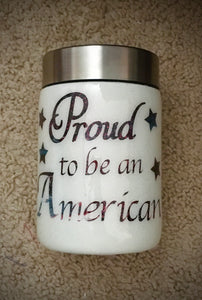 Proud to be an American is a bottle/can cooler holder that can hold your beverage cold for several hours.  It is decorated as a peek-a-boo holder with red, white, and blue ink technique then painted over and designed as you see it. These tumblers can be ready in one to two weeks. We can personalize and customize these tumblers. This is a custom order. Cancellations can only be made if they are on the same business day as the initial order.