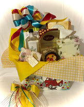 Load image into Gallery viewer, Sending Sunshine Your Way ~ is a &quot;Best Seller!&quot; this perfect gift can brighten someone&#39;s day! It is filled with delicious treats to eat and treats to pamper. It is a Large 11&quot; x 6&quot; x 8&quot;. We make this gift for those special moms, dads, nanas, new moms, get well soon, or for anyone you want to make smile. We&#39;ve included: Bath &amp; Body products such as bath wash, body cream, or body spray, a soft hair band or regular-size exfoliating body sponge, a large-size hand-wrapped artisanal soap,