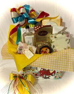 Sending Sunshine Your Way ~ is a "Best Seller!" this perfect gift can brighten someone's day! It is filled with delicious treats to eat and treats to pamper. It is a Large 11" x 6" x 8". We make this gift for those special moms, dads, nanas, new moms, get well soon, or for anyone you want to make smile. We've included: Bath & Body products such as bath wash, body cream, or body spray, a soft hair band or regular-size exfoliating body sponge, a large-size hand-wrapped artisanal soap,