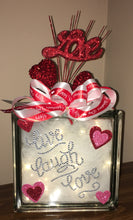Load image into Gallery viewer, This Valentine&#39;s Day Block lights up with battery-operated lights. We can customize a saying and add names with vinyl-only not rhinestones. We can design this block the way you want with different colors. This is a double-sided block that can be placed anywhere or in any room to decorate for Valentine&#39;s Day! Decorative picks and ribbons may vary.